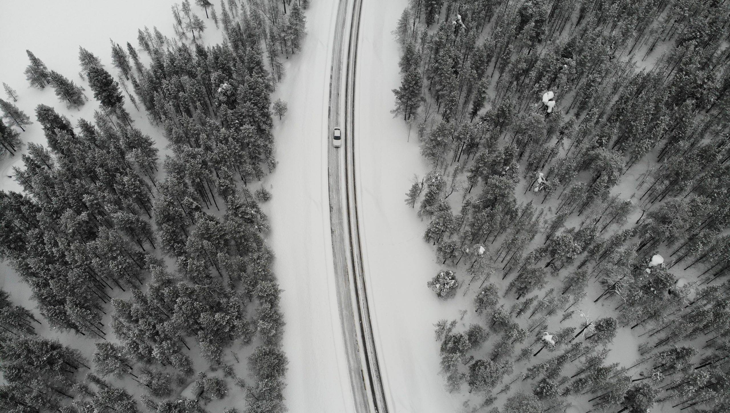 7 Minimalist Ways to Regain Control Over Your Life Right Now - drone shot of road in snow