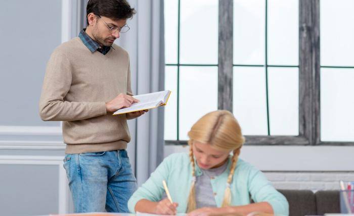 How to Choose a Tutor for Your Child? – Steps to Follow front view teacher standing child listening him 23 2148511027